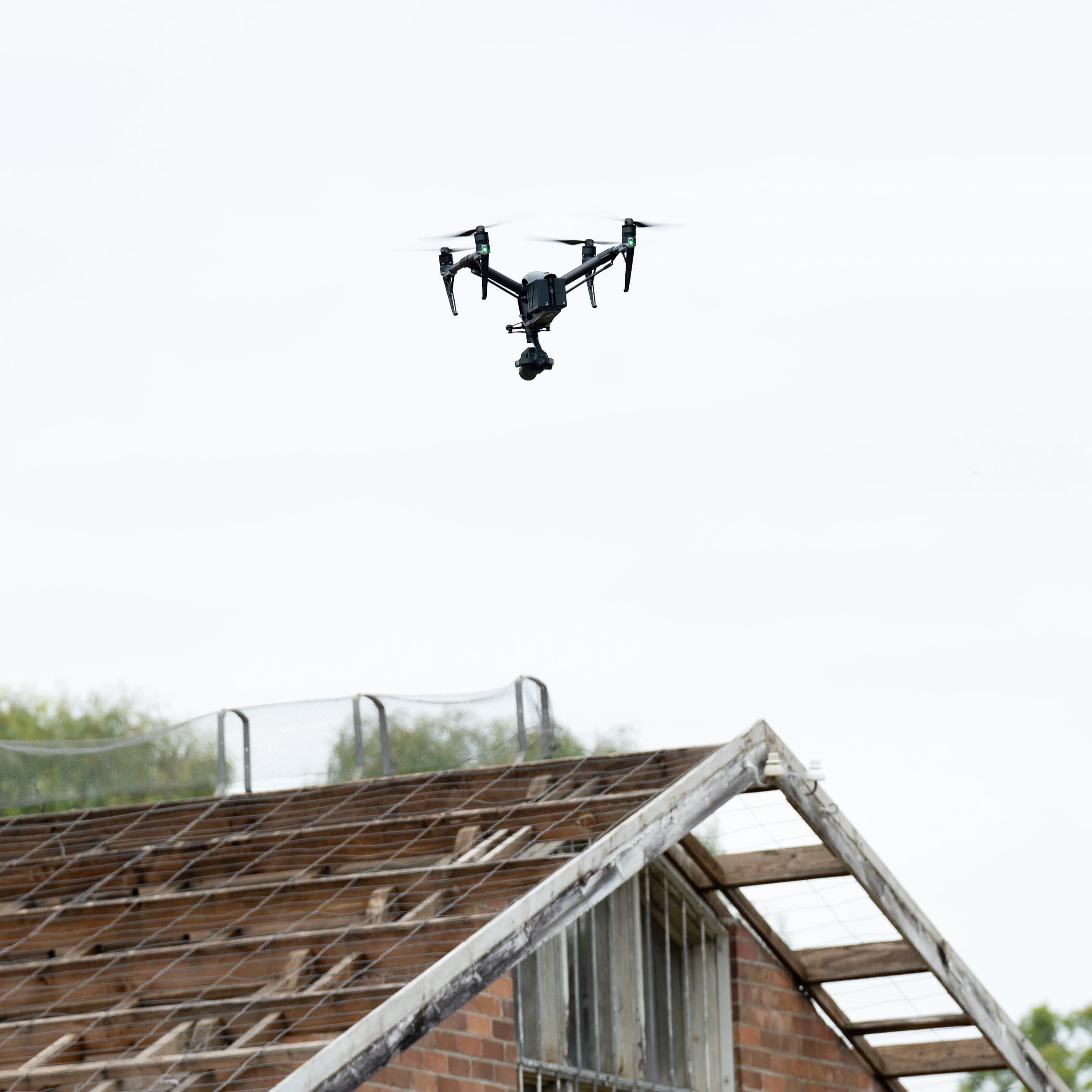 a drone flying over a house